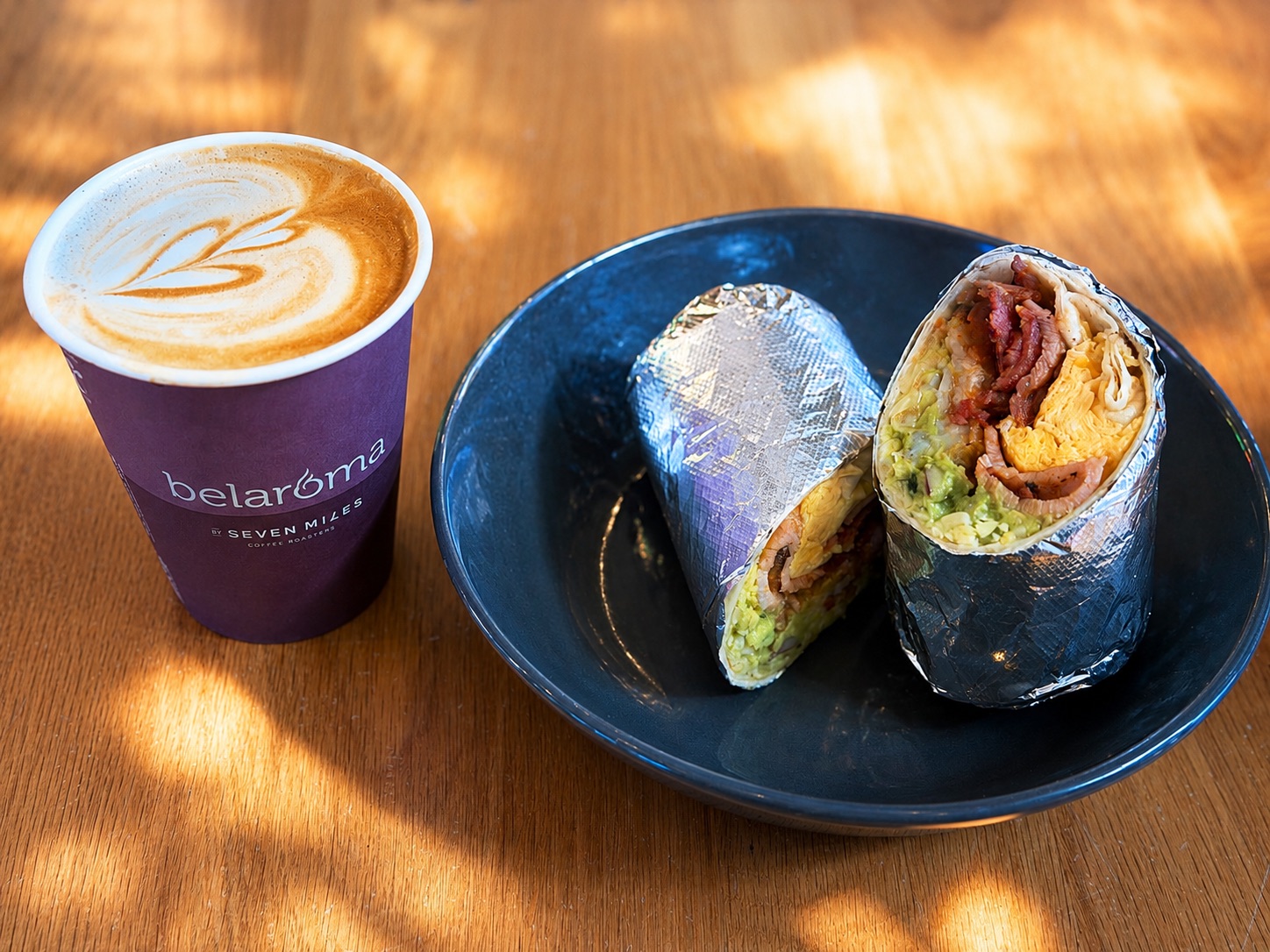Breakfast burrito with golden potatoes and dipping sauce